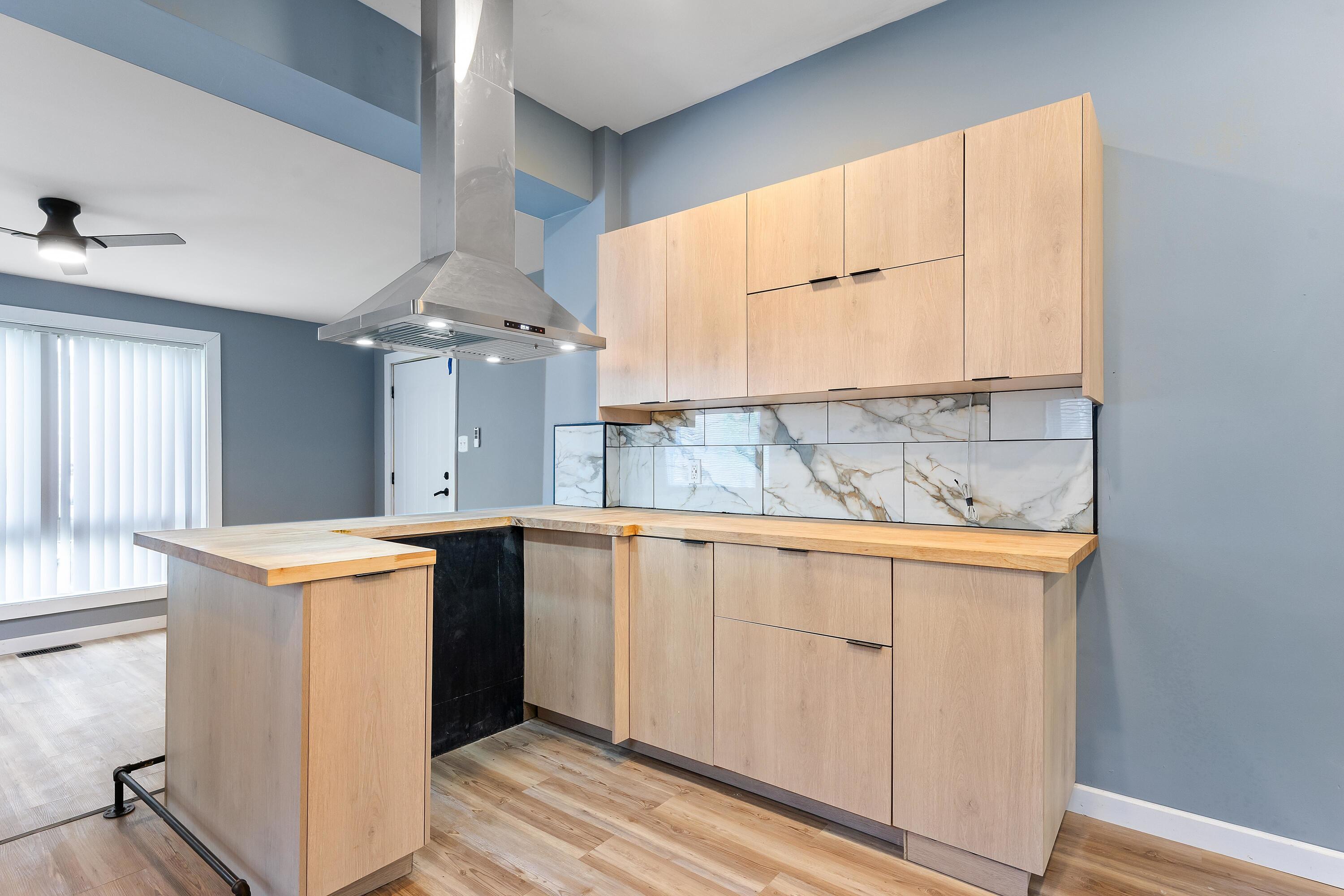 1317 Harrison Street Gary, IN 46407 - Photo 16 of 40 a view of a kitchen with granite countertop cabinets and a sink