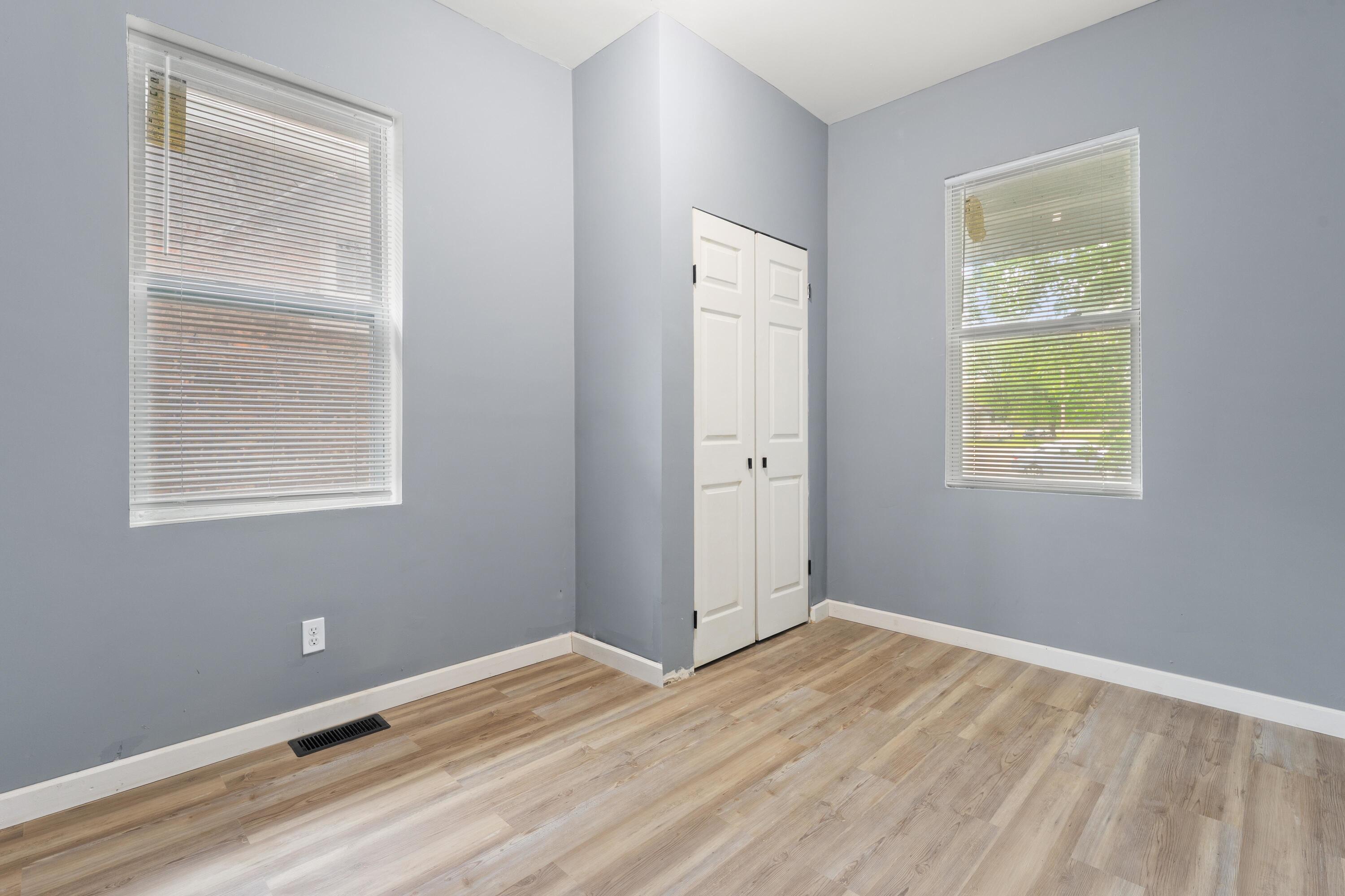 1317 Harrison Street Gary, IN 46407 - Photo 24 of 40 a view of an empty room with wooden floor and a window