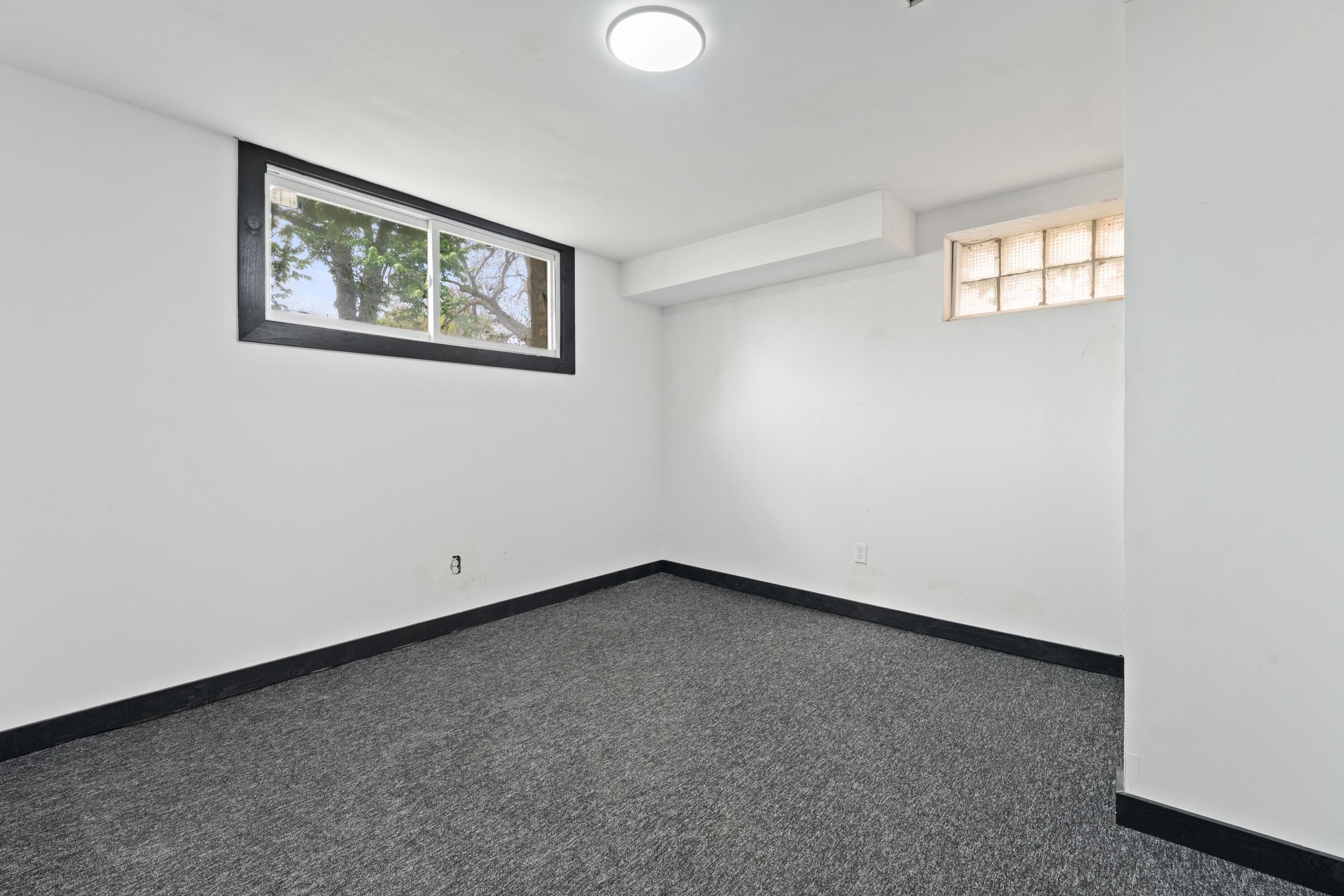 1317 Harrison Street Gary, IN 46407 - Photo 28 of 40 a view of an empty room with a window