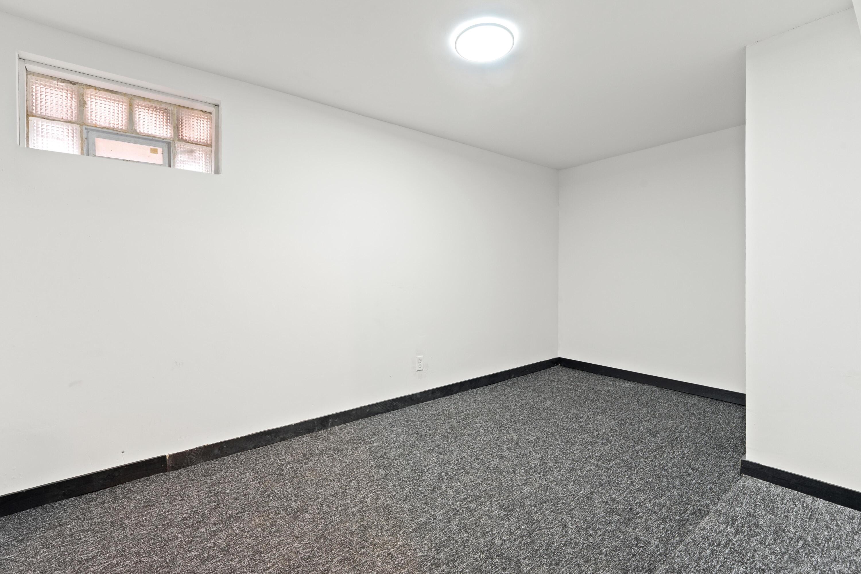 1317 Harrison Street Gary, IN 46407 - Photo 29 of 40 an empty room with a window