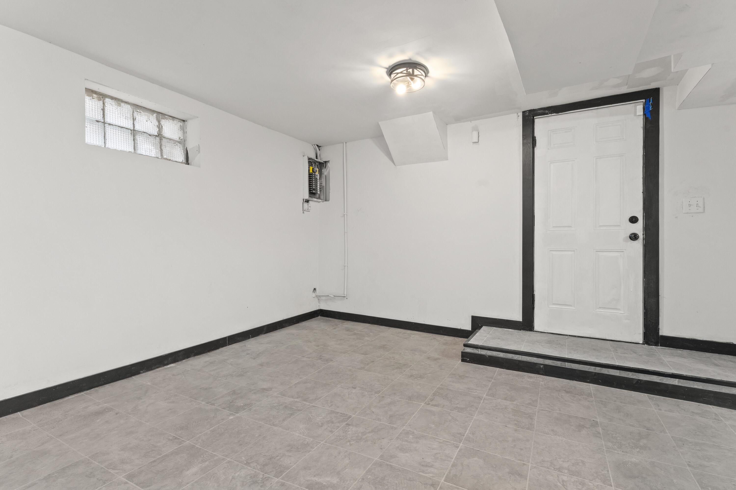 1317 Harrison Street Gary, IN 46407 - Photo 34 of 40 an empty room with a empty space and windows