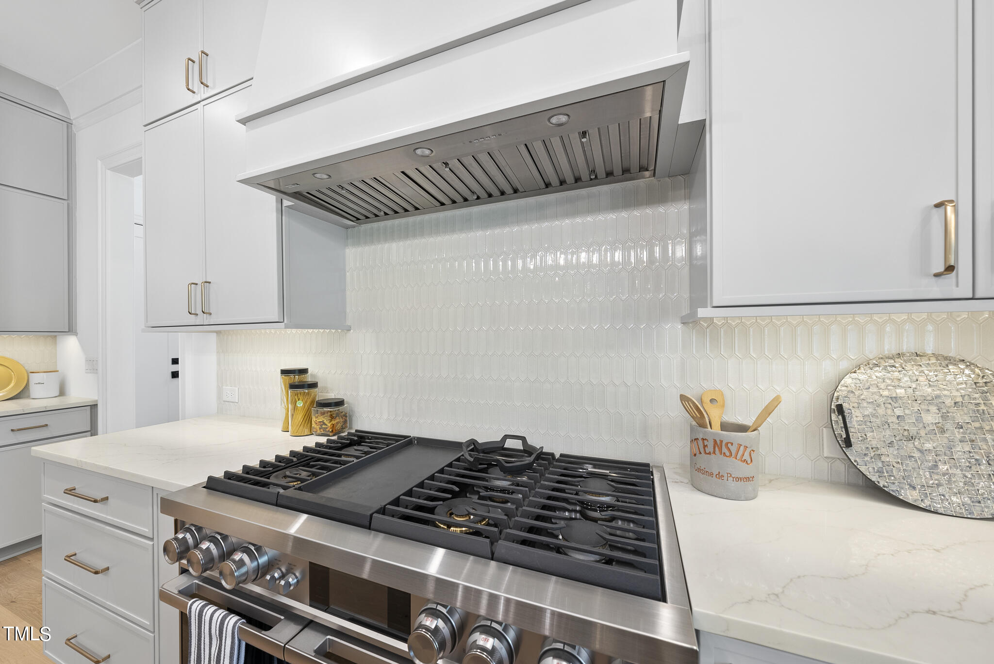 3428 Leonard Street Raleigh, NC 27607 - Photo 11 of 49 a kitchen with granite countertop a stove and a cabinet