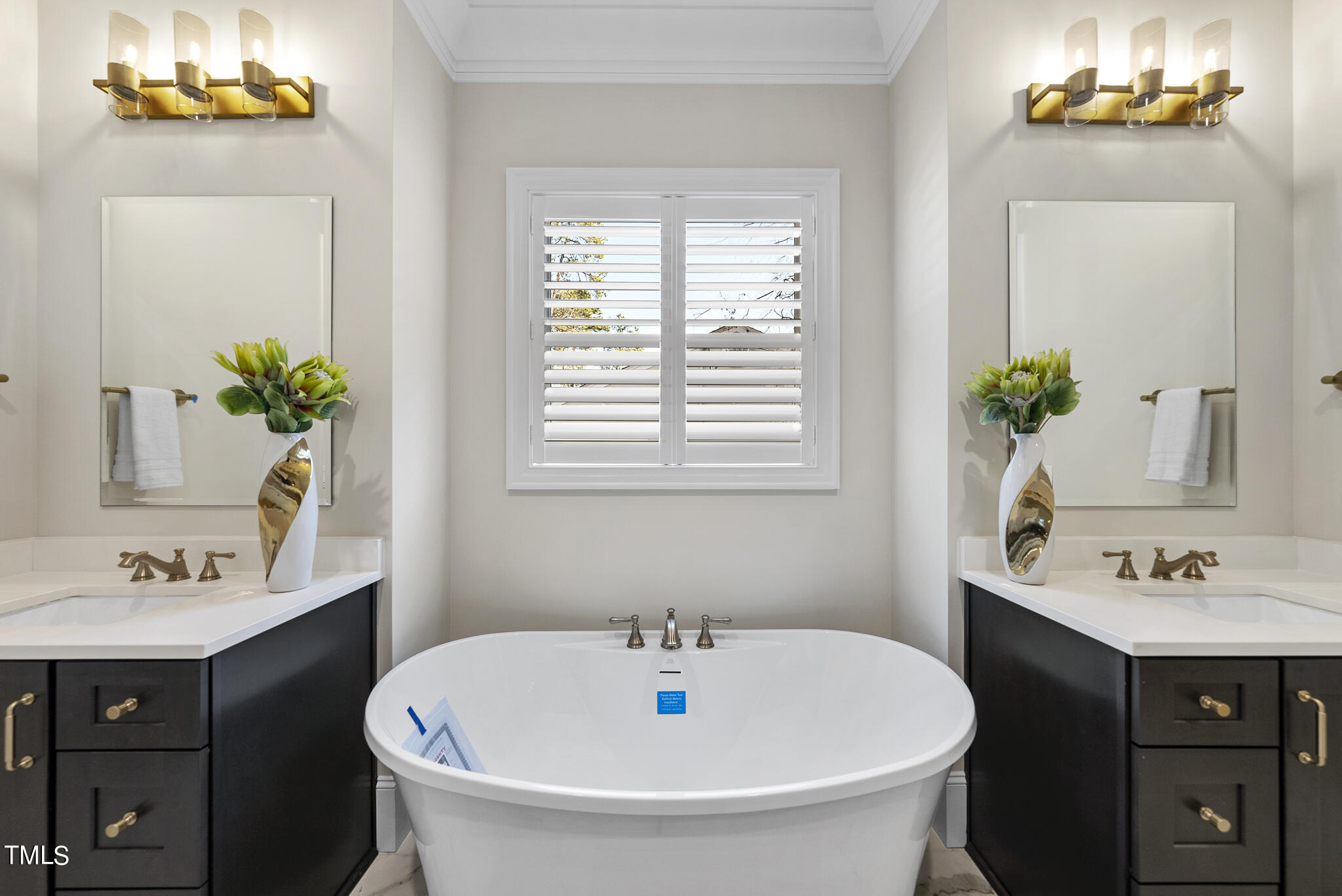 3428 Leonard Street Raleigh, NC 27607 - Photo 18 of 49 a bathroom with a sink and a mirror
