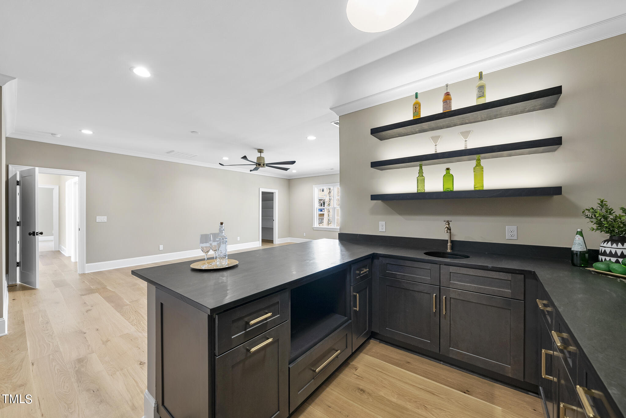 3428 Leonard Street Raleigh, NC 27607 - Photo 31 of 49 a kitchen with stainless steel appliances a sink dishwasher and cabinets with wooden floor