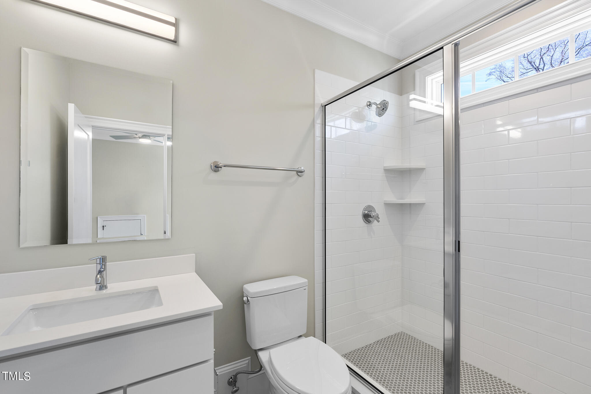 3428 Leonard Street Raleigh, NC 27607 - Photo 38 of 49 a bathroom with a sink toilet mirror and shower