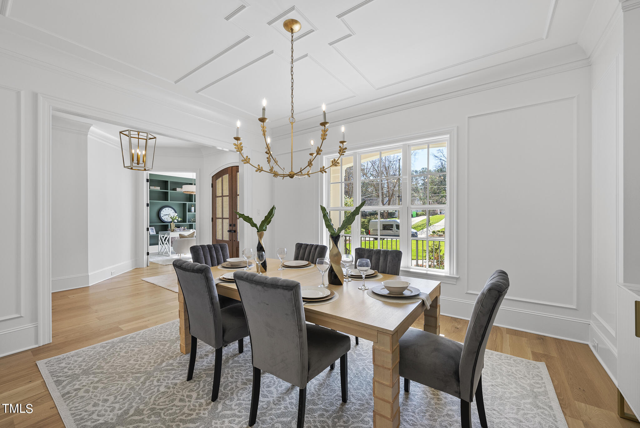 3428 Leonard Street Raleigh, NC 27607 - Photo 4 of 49 a view of a dining room with furniture a chandelier and wooden floor