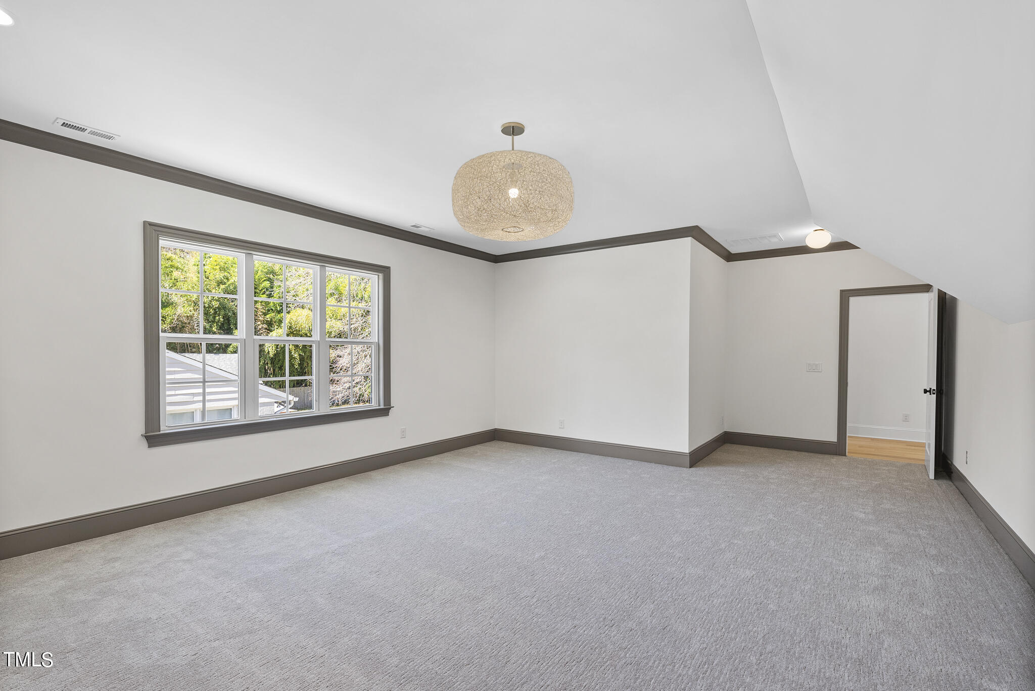 3428 Leonard Street Raleigh, NC 27607 - Photo 41 of 49 an empty room with windows and entrance