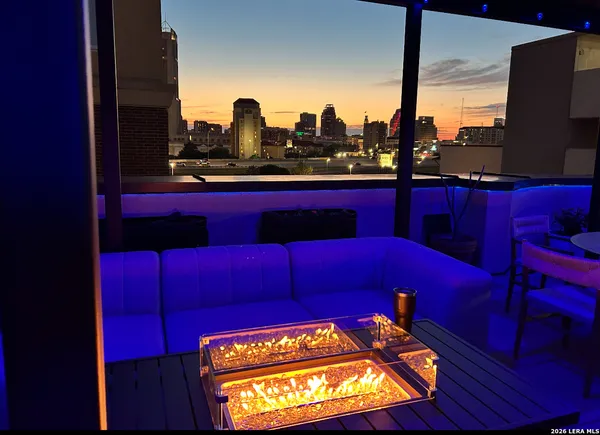 a view of a red top table and chair in the room