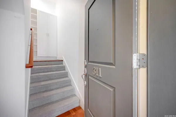 a view of entryway with wooden floor