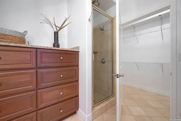 a bathroom with a shower and a mirror