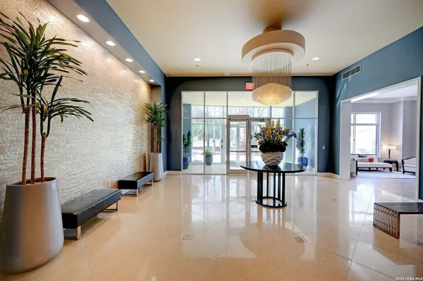 a view of a lobby with furniture and floor to ceiling window