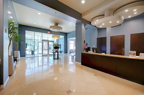 a lobby with furniture and window