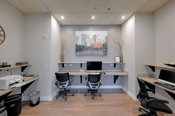 a view of a workspace with furniture and a workspace