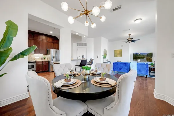 a view of a dining room with furniture and wooden floor
