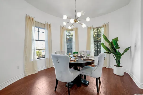 a view of a dining room with furniture window and wooden floor