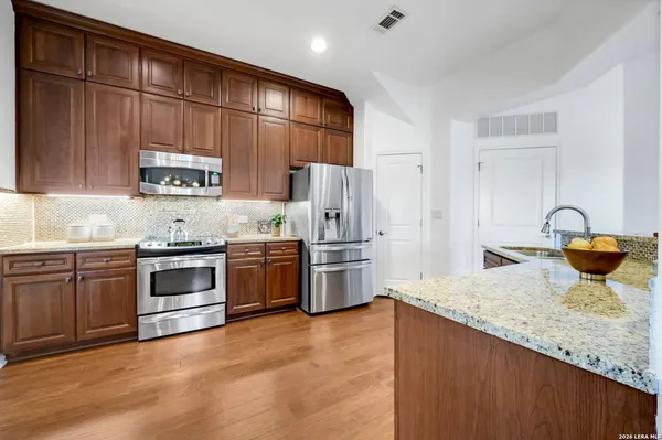 a kitchen with a sink and a stove