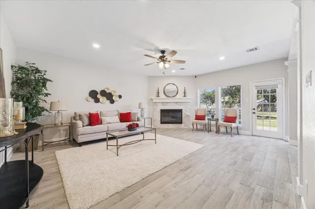a living room with furniture and a fireplace
