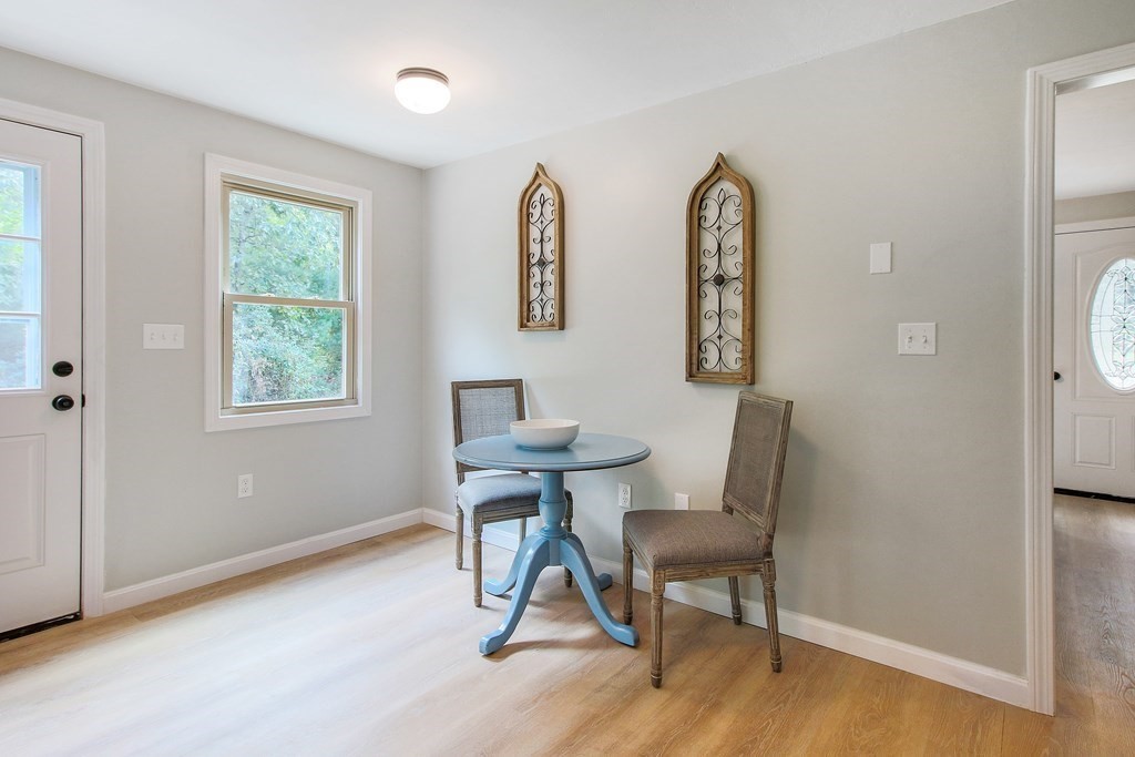 151 Harkness Road, Unit B North Smithfield, RI 02896 - Photo 17 of 36 a view of a workspace with furniture and a window