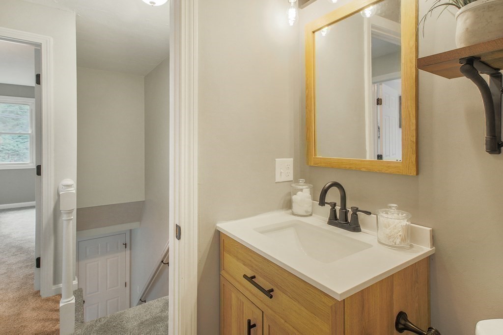 151 Harkness Road, Unit B North Smithfield, RI 02896 - Photo 30 of 36 a bathroom with a sink and a mirror
