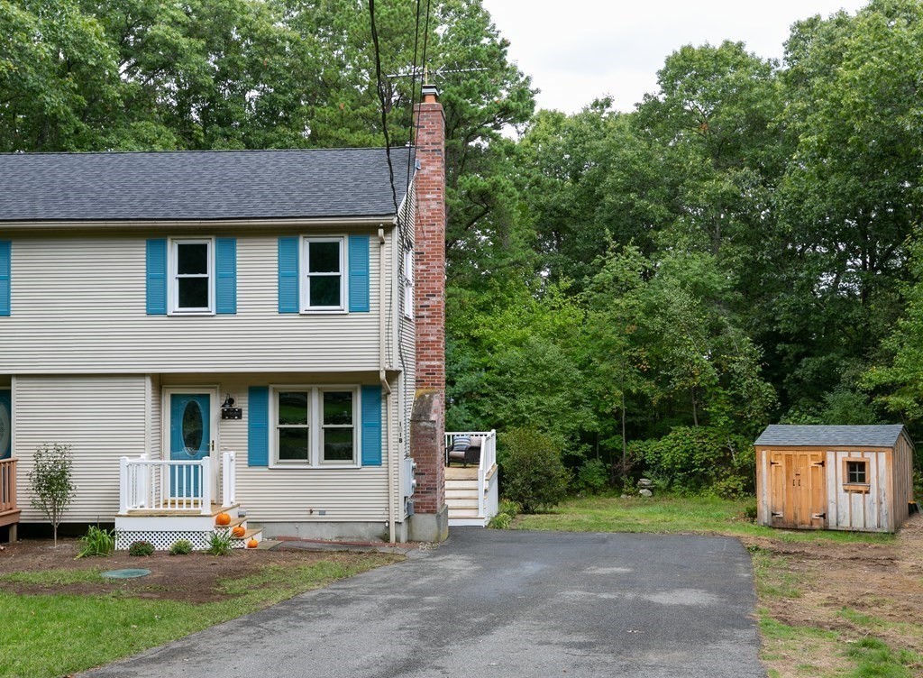 151 Harkness Road, Unit B North Smithfield, RI 02896 - Photo 4 of 36 a view of a house with a yard and large tree