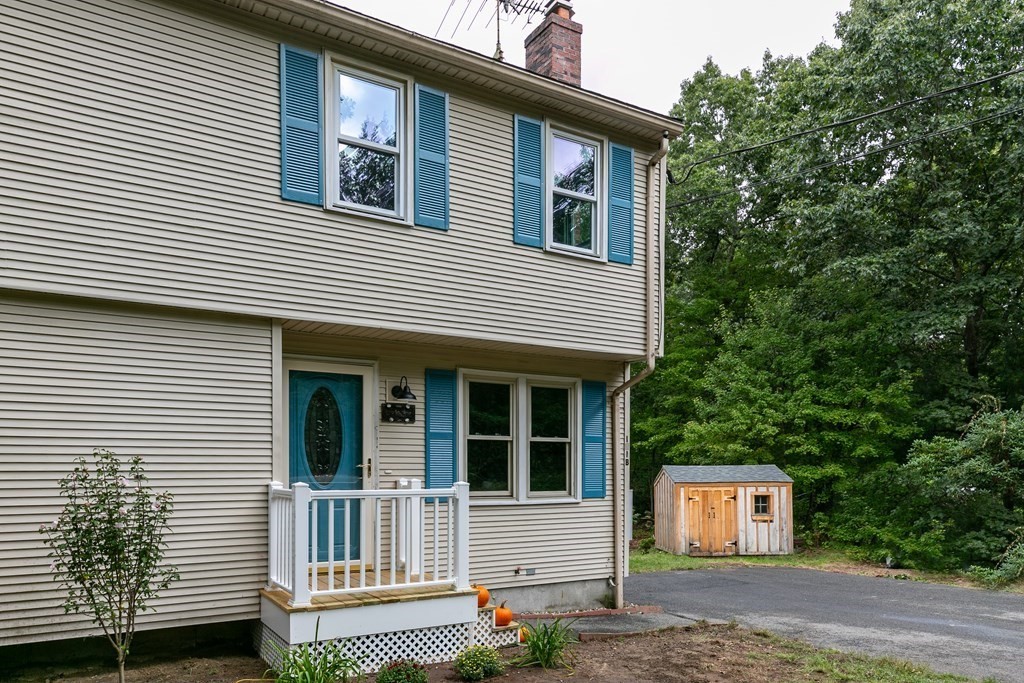 151 Harkness Road, Unit B North Smithfield, RI 02896 - Photo 9 of 36 a house view with a backyard space