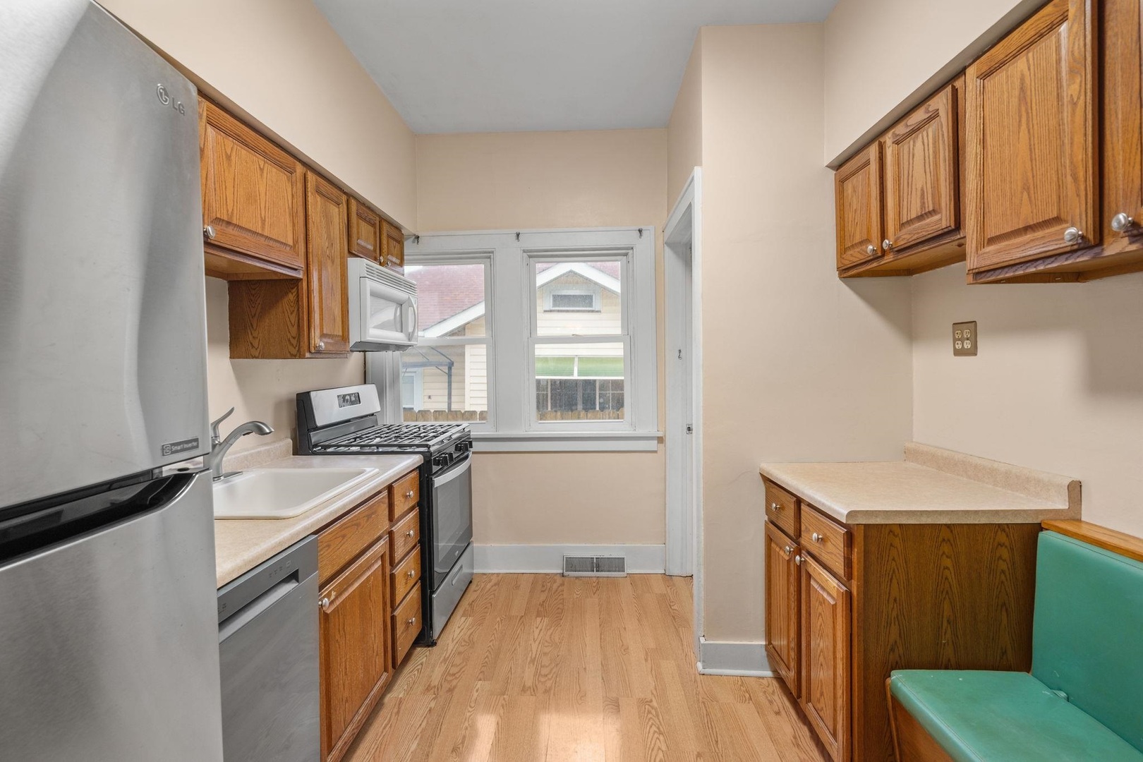 2327 6th Street Moline, IL 61265 - Photo 12 of 22 a kitchen with stainless steel appliances granite countertop a stove and a sink