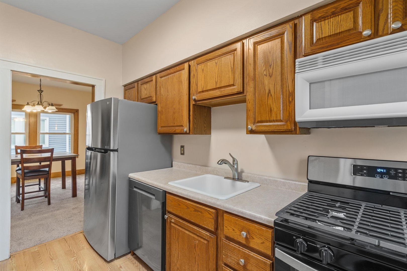 2327 6th Street Moline, IL 61265 - Photo 13 of 22 a kitchen with stainless steel appliances granite countertop a refrigerator and a stove top oven