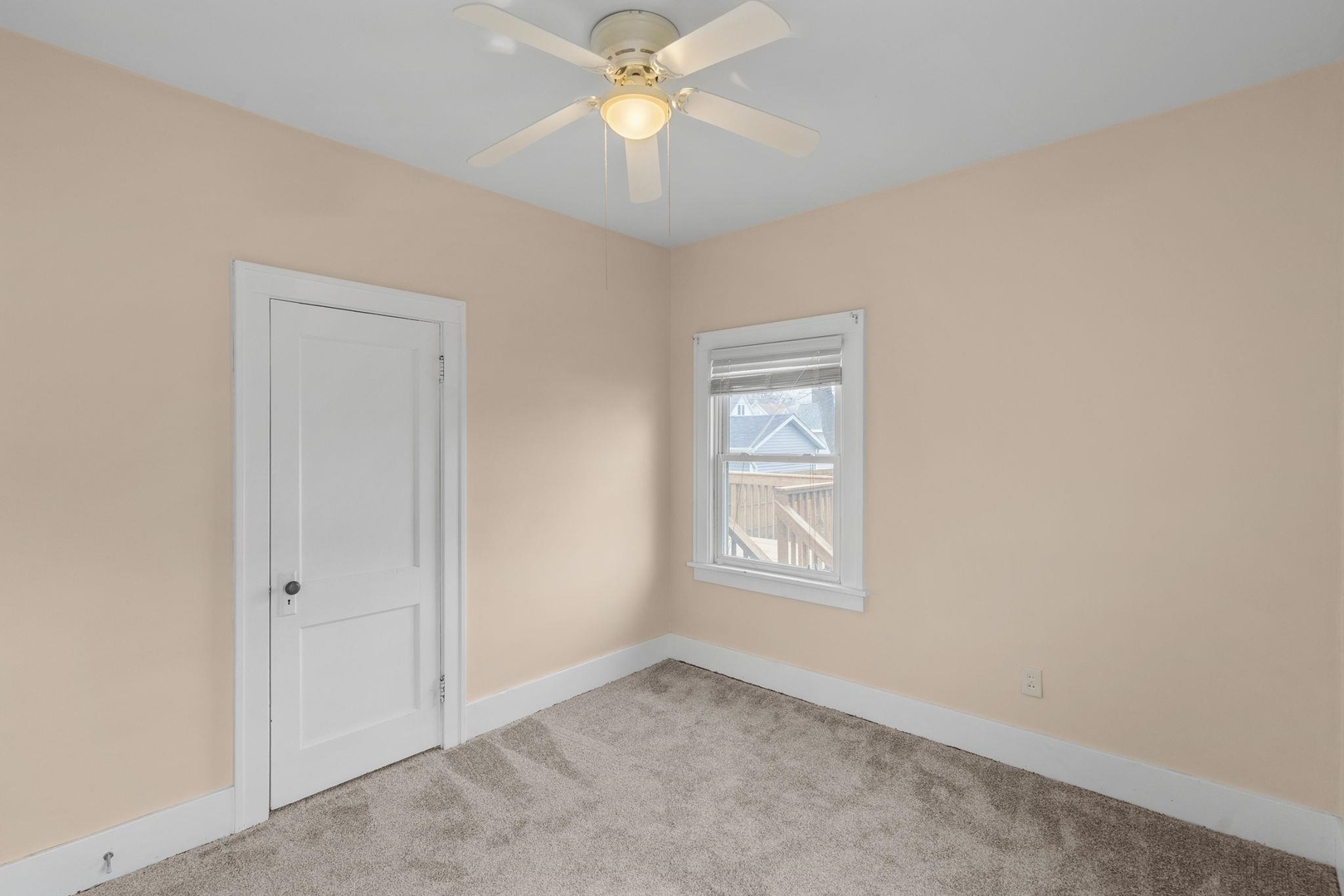 2327 6th Street Moline, IL 61265 - Photo 20 of 22 an empty room with windows and fan