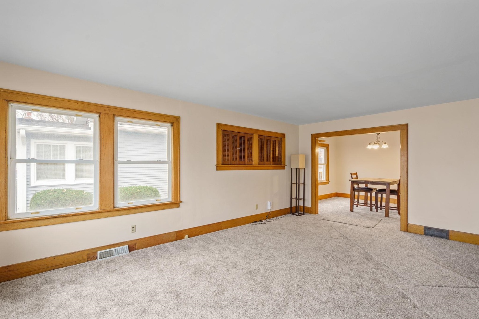 2327 6th Street Moline, IL 61265 - Photo 8 of 22 a view of an empty room with window and a kitchen