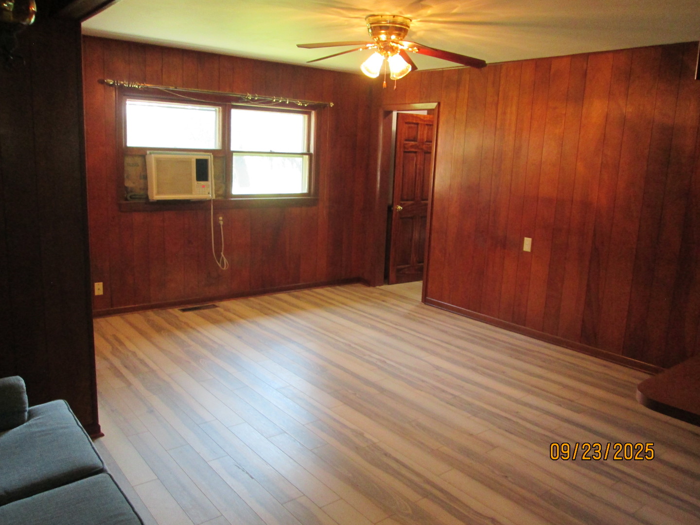 1806 Dallas Place Joliet, IL 60433 - Photo 8 of 13 a bedroom with a bed and a chandelier