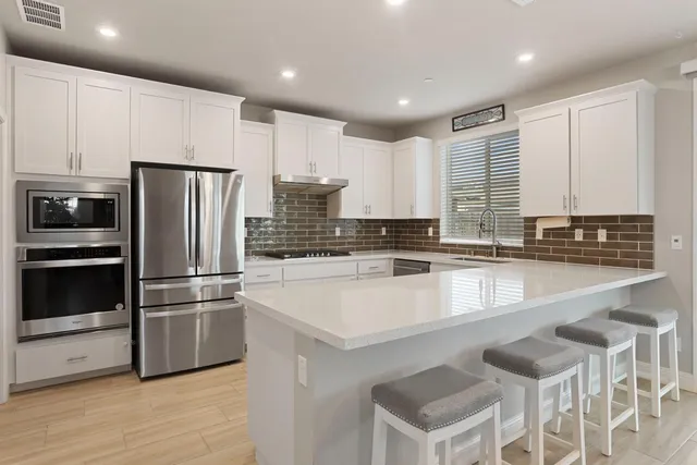 a room with a dresser and a window