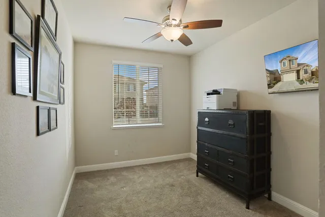 a utility room with cabinets washer and dryer