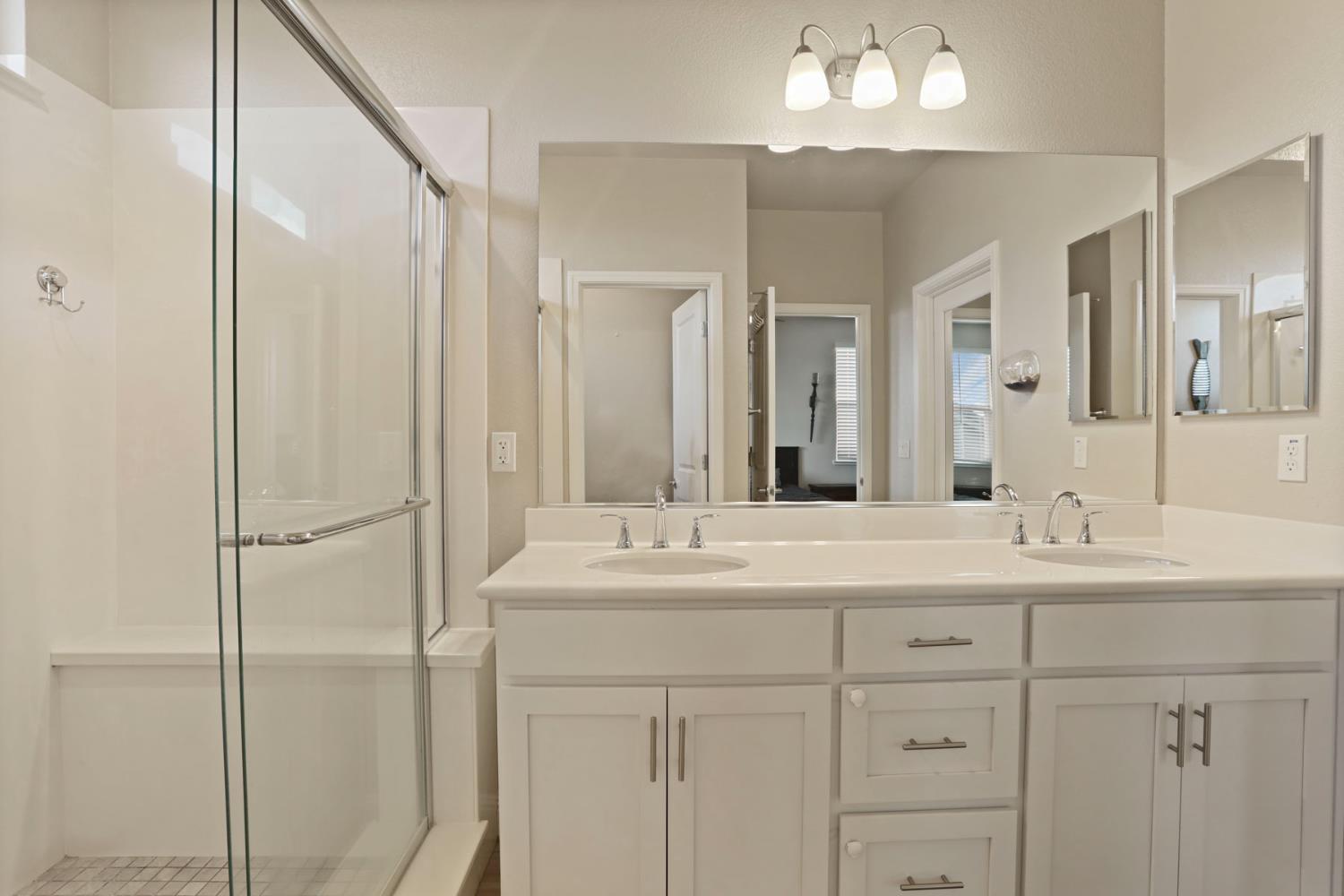 2905 Zinnia Way Lodi, CA 95242 - Photo 33 of 47 a bathroom with a sink double vanity and a mirror