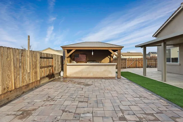 a kitchen with a stove and a sink