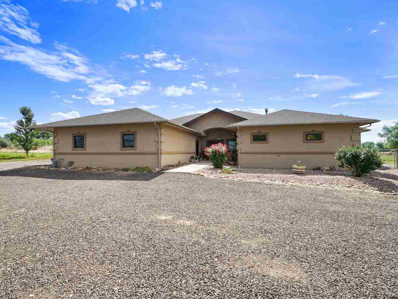 912 23 Road Grand Junction, CO 81505 - Photo 2 of 42 a front view of house with a yard
