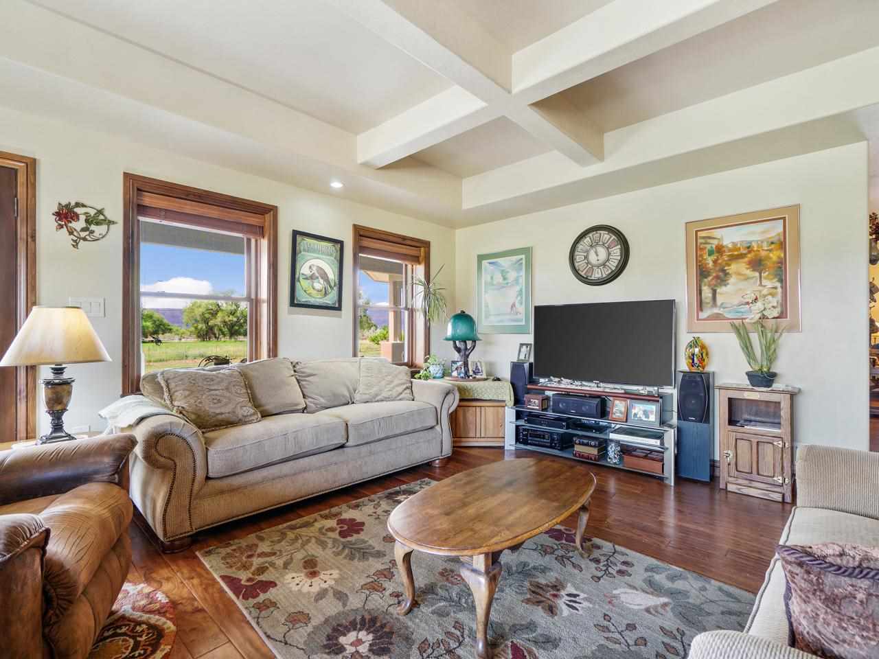 912 23 Road Grand Junction, CO 81505 - Photo 23 of 42 a living room with furniture and a flat screen tv