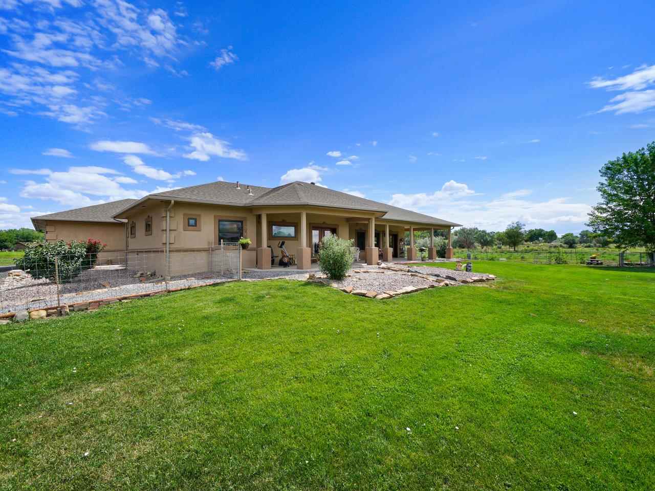 912 23 Road Grand Junction, CO 81505 - Photo 3 of 42 a view of a house with a backyard