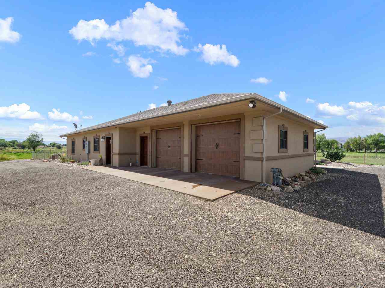 912 23 Road Grand Junction, CO 81505 - Photo 4 of 42 a front view of a house with a yard