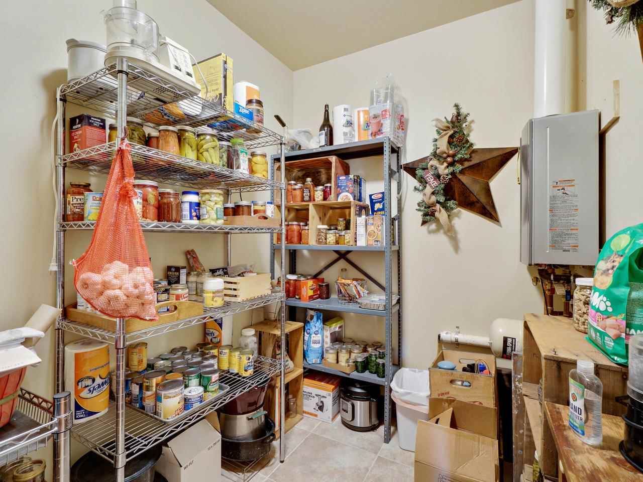 912 23 Road Grand Junction, CO 81505 - Photo 6 of 42 a store room with storage and utility room