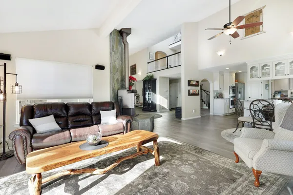 a living room with furniture and a chandelier