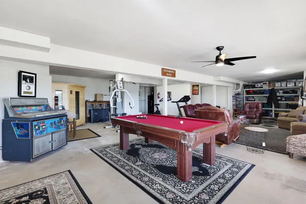 a living room with furniture and a rug