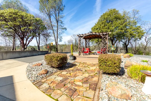 a view of balcony with wooden floor and fence