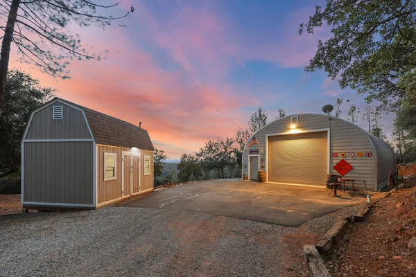 a view of a backyard of the house