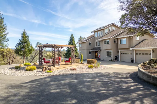 a view of a city with lush green forest