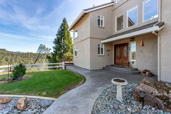 a front view of a house with a yard