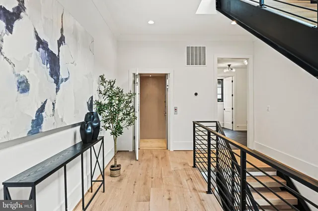 a living room with furniture and large windows
