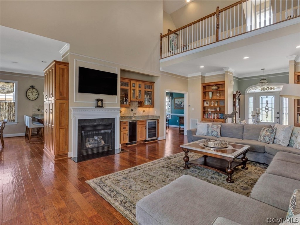 16001 Alsdell Road Midlothian, VA 23112 - Photo 12 of 44 a living room with furniture a flat screen tv and a fireplace