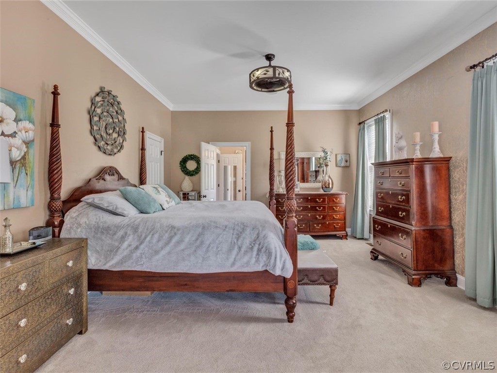 16001 Alsdell Road Midlothian, VA 23112 - Photo 24 of 44 a spacious bedroom with a bed and a chandelier
