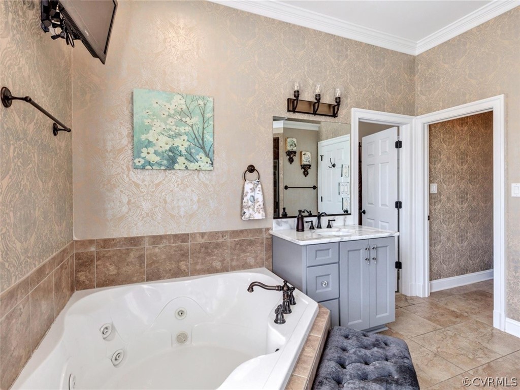 16001 Alsdell Road Midlothian, VA 23112 - Photo 28 of 44 a bathroom with a bath tub a sink and a mirror