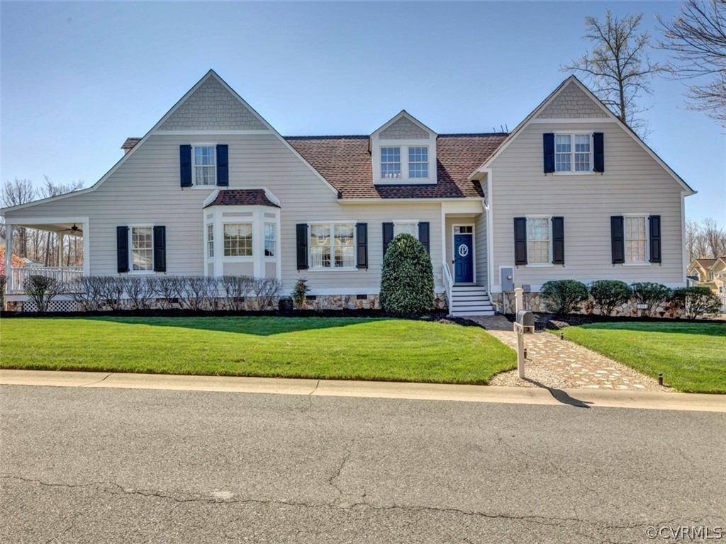 16001 Alsdell Road Midlothian, VA 23112 - Photo 3 of 44 a front view of a house with a garden and trees
